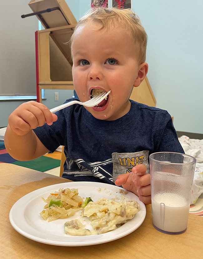 Little boy enjoying meal